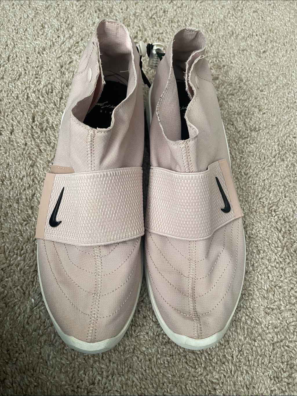 Nike Light Pink Slip-On Sneakers With Black Swoosh
